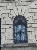 Bullet-scarred doorway in former army headquarters, Budapest