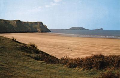 Wales: Rhossili Bay on the Gower Peninsula. Dylan Thomas wrote about the beauty of this place in a short story.