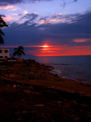Beautiful sunset over destroyed beachfront homes