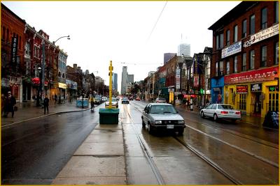 Looking at Queen East at Spadina on a rainy day