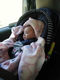 With her blanket from Grandma designed spec. for car seats!