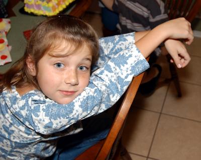 Mere Leaning on Chair