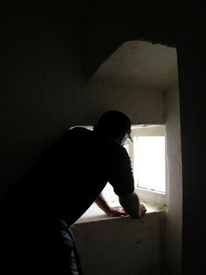 Mike looking through the window of HookLighthouse
