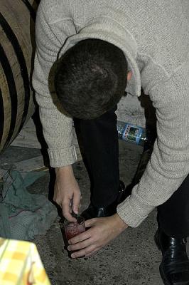 checking the progress of the wine