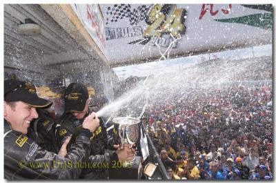 The  winning Holden team showered the crowd with Champagne