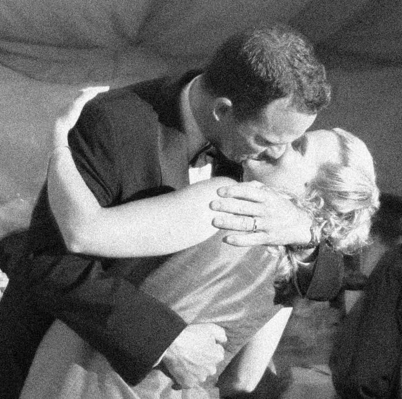 The Big Entry Kiss at the Reception - grainy