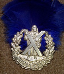 Queen's Own Cameron Highlanders cap badgewith blue hackle