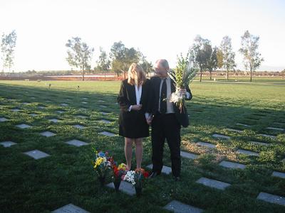 aunt debbie and her husband Bob at his father's grave