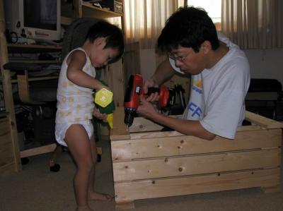 I'm helping Papa dismantle these shelves!