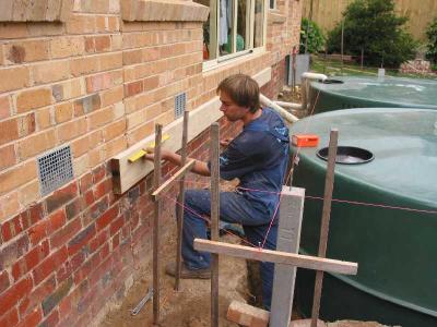 wall plate bolted to bricks