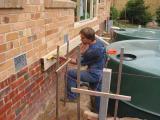 wall plate bolted to bricks