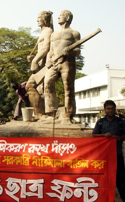 Man holding banner, Liberation War (1971) monument