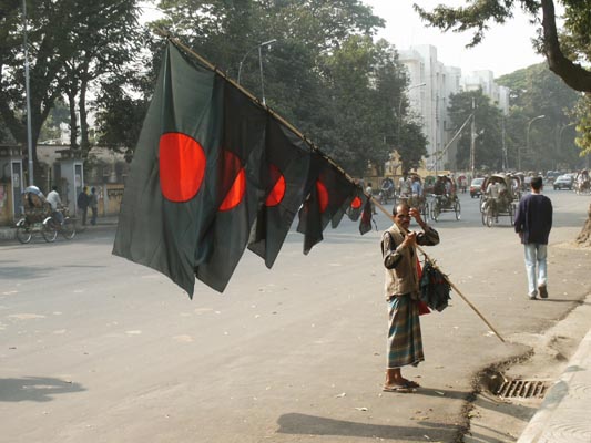 Selling flags for upcoming national holiday. Green for the fertile land, Red for the blood of the people shed in 1971 war