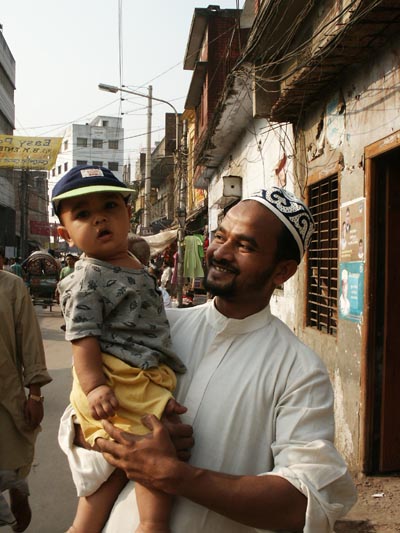 Man holding child, Dhaka