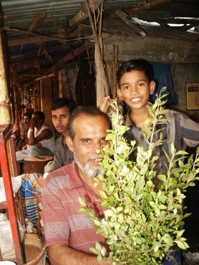 Man and boy at produce market, Dhaka