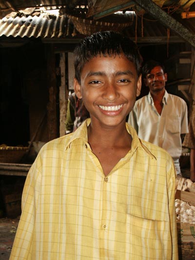 Smiling boy in yellow shirt, Dhaka