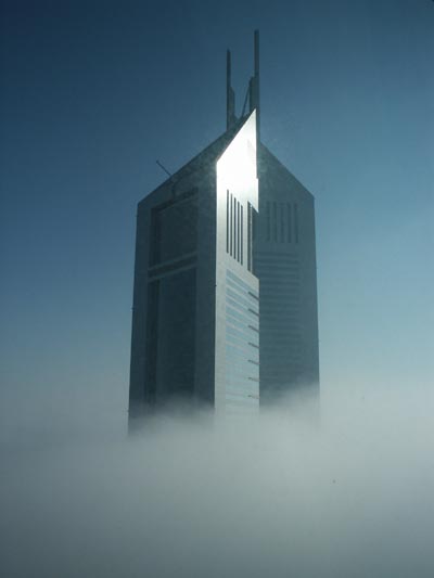 Emirates Towers rising out of the fog