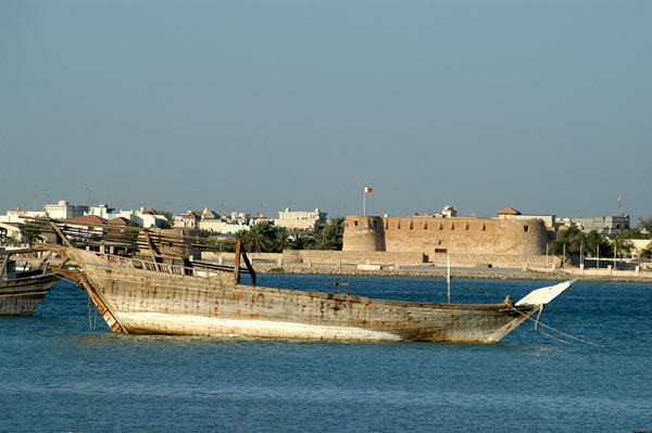 A dhow moored in front of Arad Fort