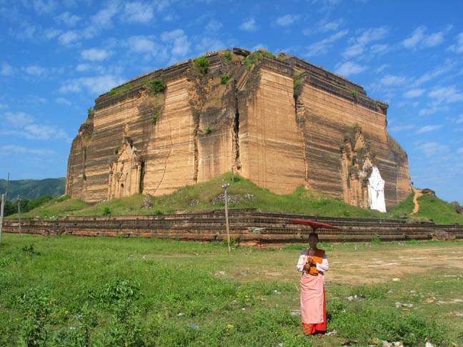 A nun poses in front of Mingun Paya.