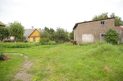 The foundation of the house two door away can still be seen