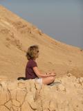 M meditating to a view over the dead sea