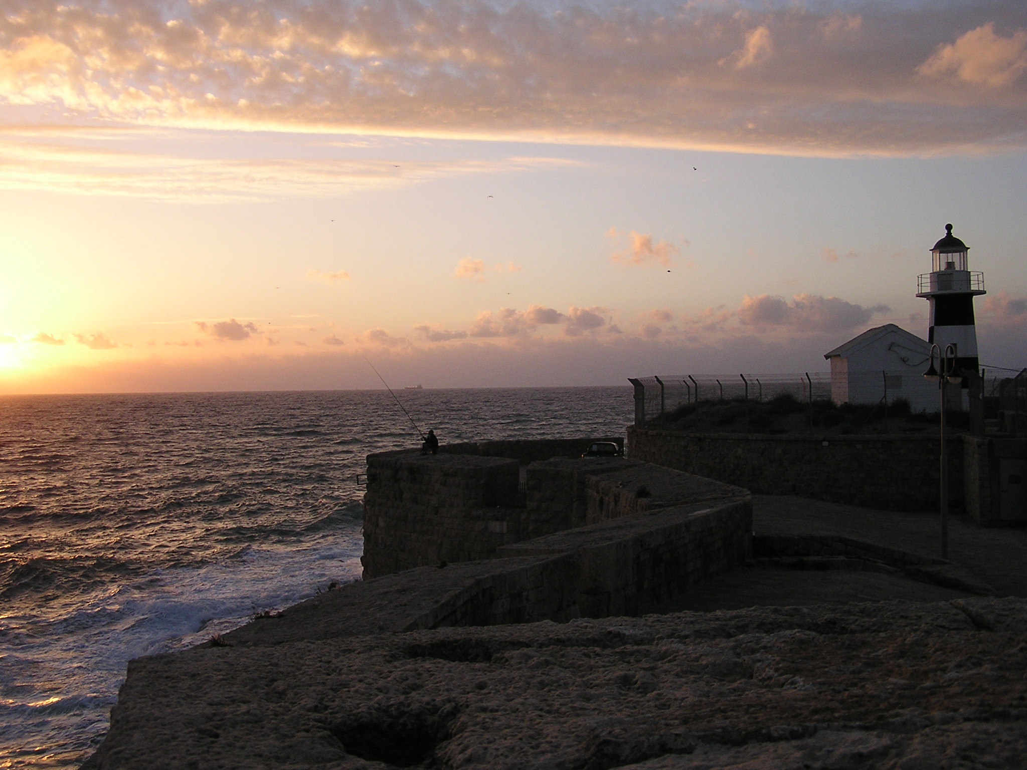 Lighthouse and fisherman.JPG