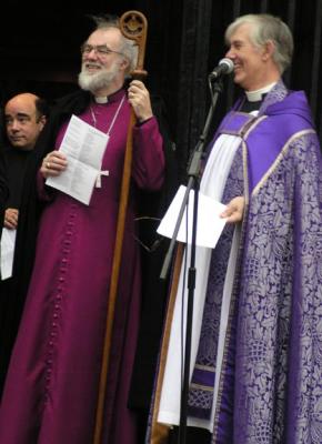 The Archbury and Dean are amused, but the monk is not.