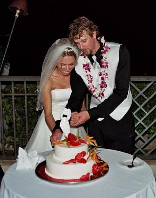 Bride and groom cutting the cake