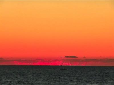 Red sky at night and sailboat