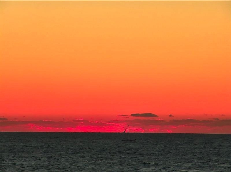 Red sky at night and sailboat