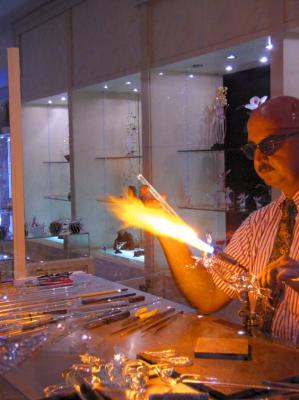 Artist working on glass sculpture