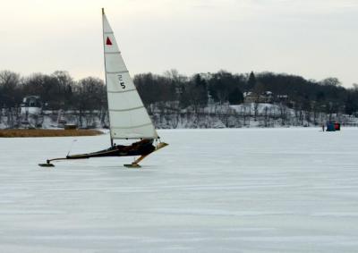 Ice sailboats were flying by.  This one is nearly airborne.