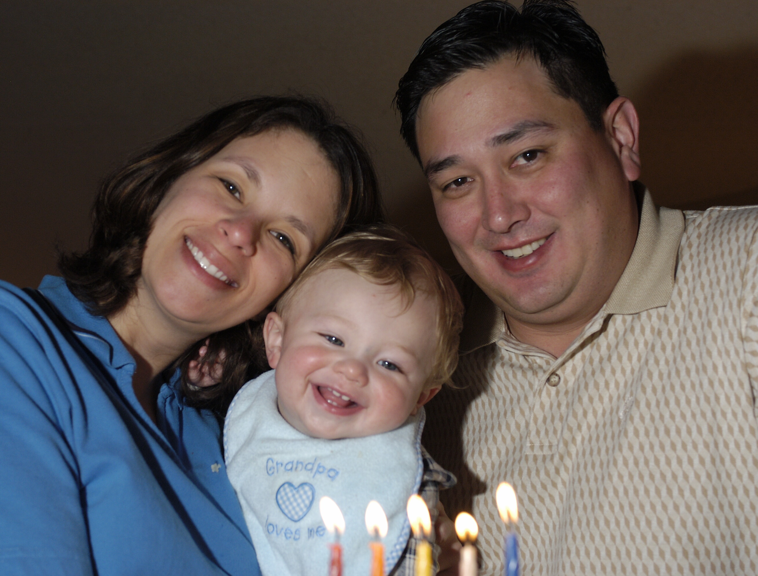 jacob and mom and dad at hanukkah.jpg