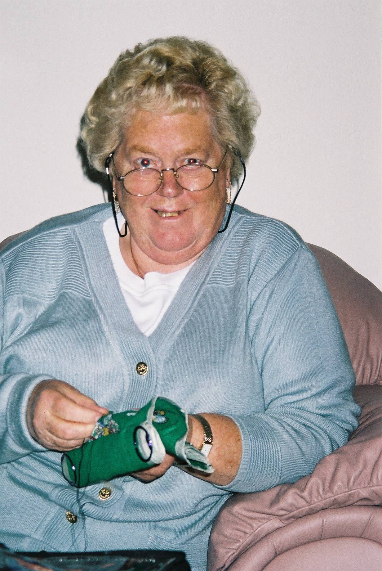 Mum cross stitching her Yard of Snowmen