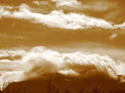 Sepia cloud embraces mountain, Coyhaique