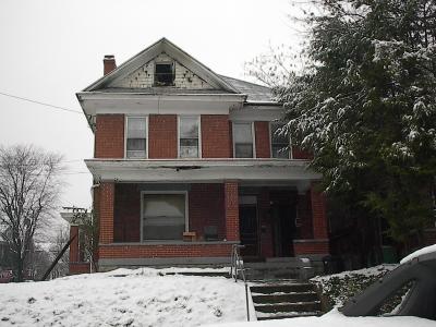 Front view of damaged house.