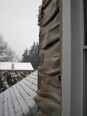 The damage to our attic dormer, opposite the flames.