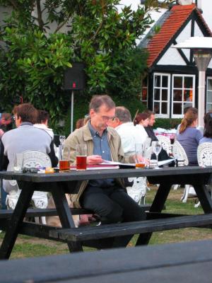Man seated outside pub, Cobham, Aug 2003