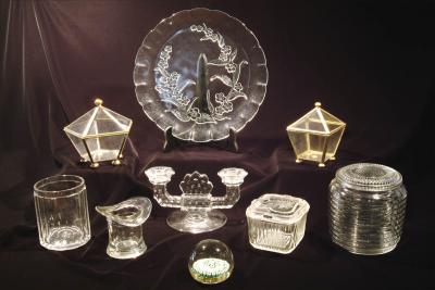 8. various pressed glass pieces, a paper weight, & 2 lidded glass boxes