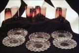 14. four small clear glass plates & 8 purple handblown tumblers