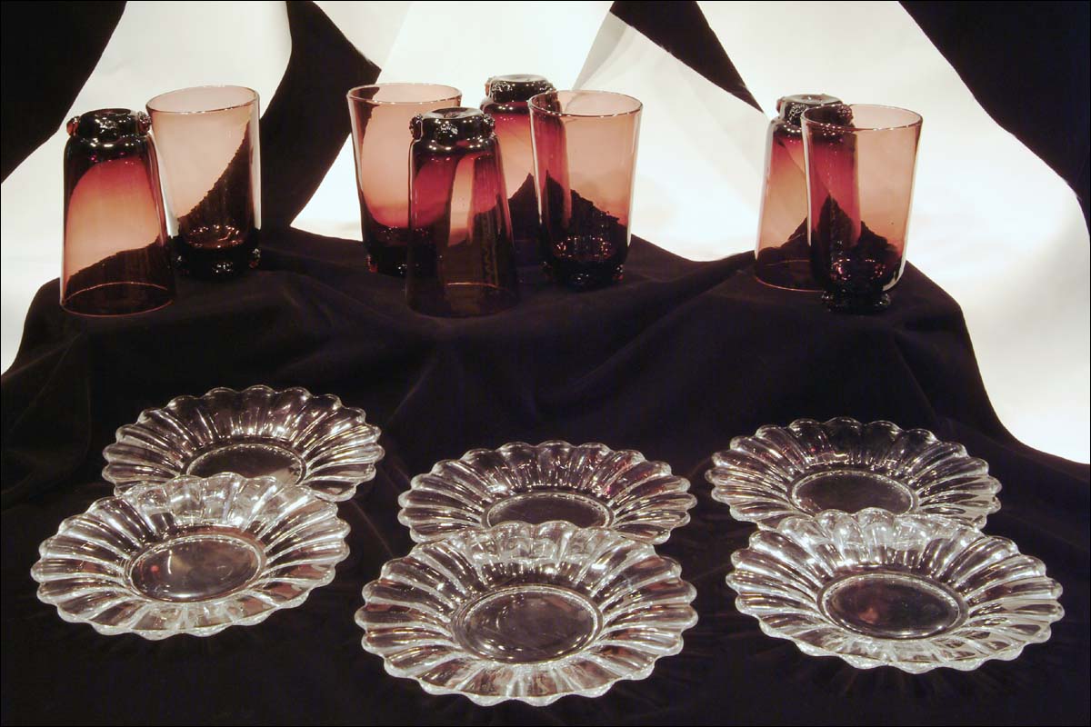 14. four small clear glass plates & 8 purple handblown tumblers