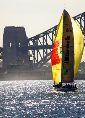 Yacht heading for Harbour Bridge and naval vessel
