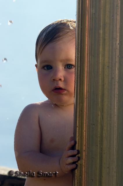 Little boy at beach shower