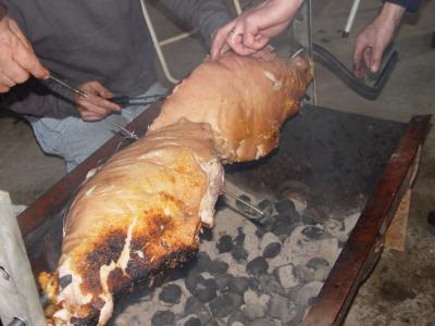 Roasting the legs of the pig.