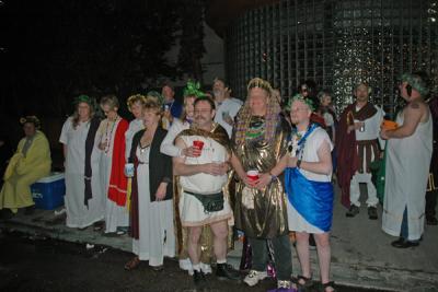 The Toga Krewe attends the Bacchus Parade