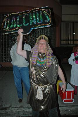 The Toga Krewe attends the Bacchus Parade