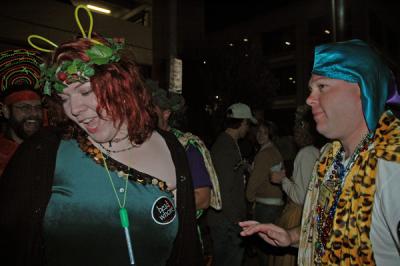 The Toga Krewe attends the Bacchus Parade