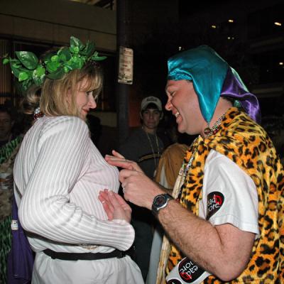 The Toga Krewe attends the Bacchus Parade