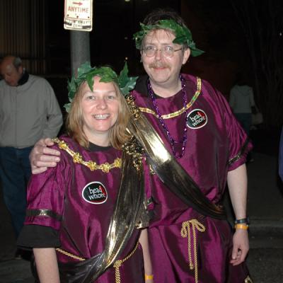 The Toga Krewe attends the Bacchus Parade