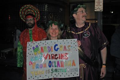 The Toga Krewe attends the Bacchus Parade